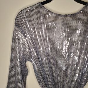 Sequin dress with bell sleeves and open back